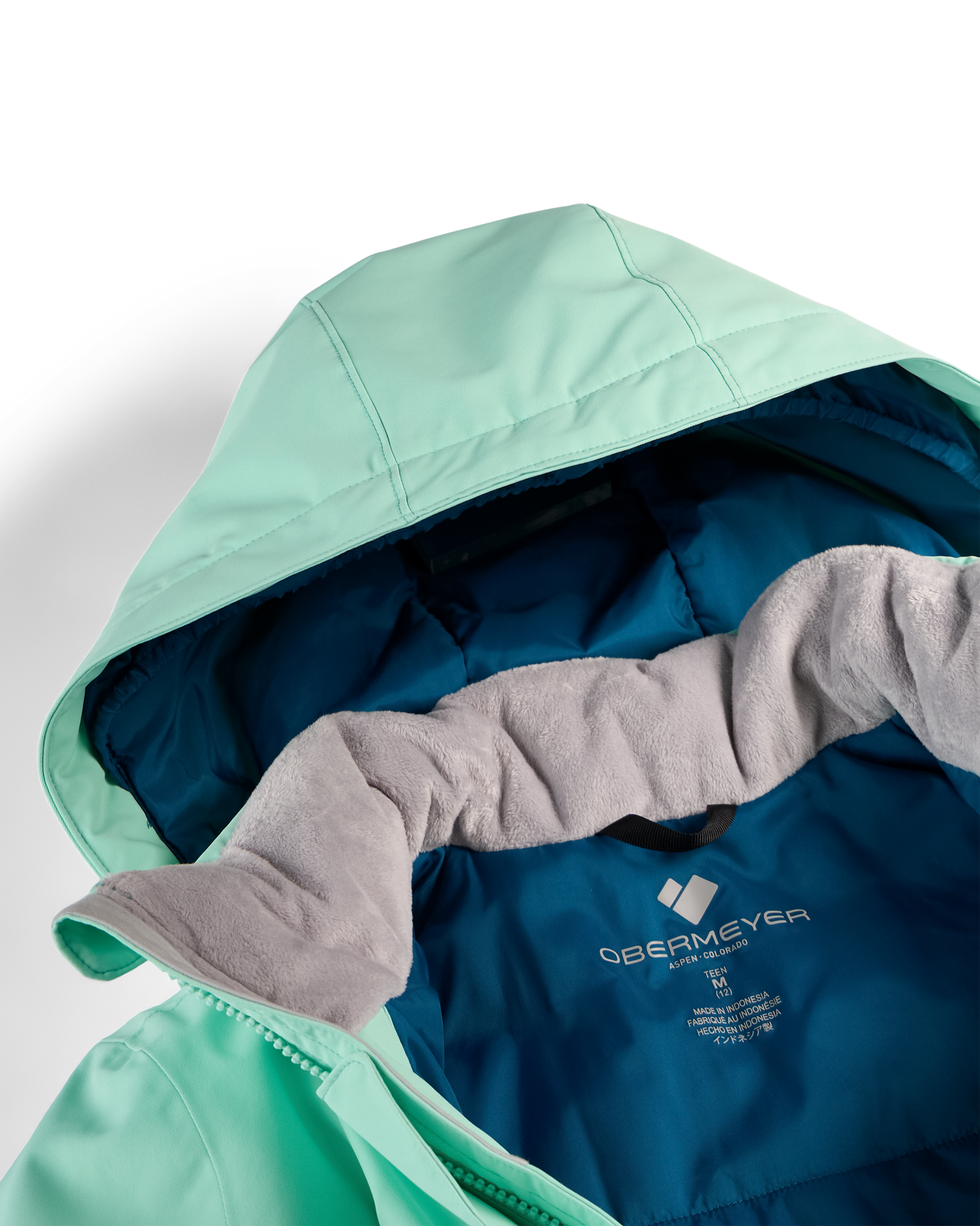 Close-up of a hooded puffer jacket showing the mint green outer shell, teal-blue interior lining, and a gray fleece inner hood lining.