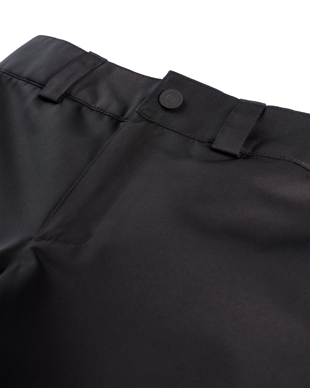 Close-up detail shot of black trousers showing the waistband, belt loops, button closure, and front seam against a white background.