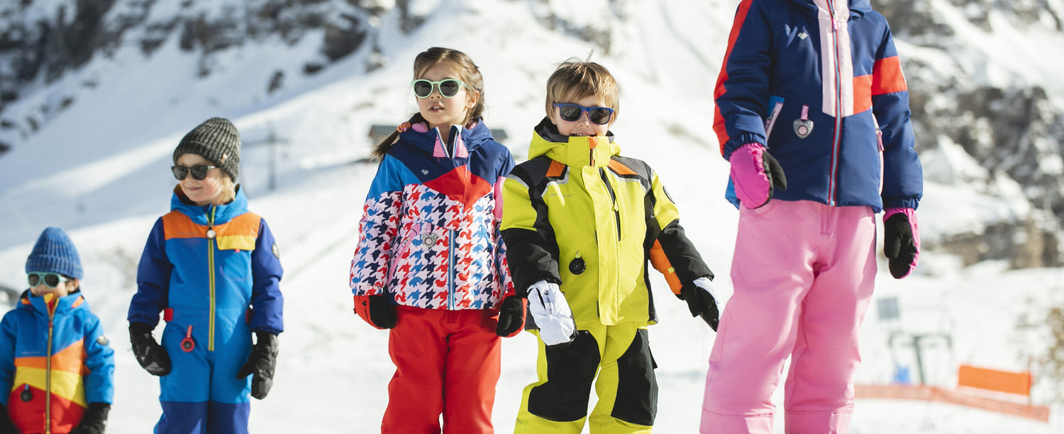 Kids wearing Obermeyer ski apparel featuring i-grow™