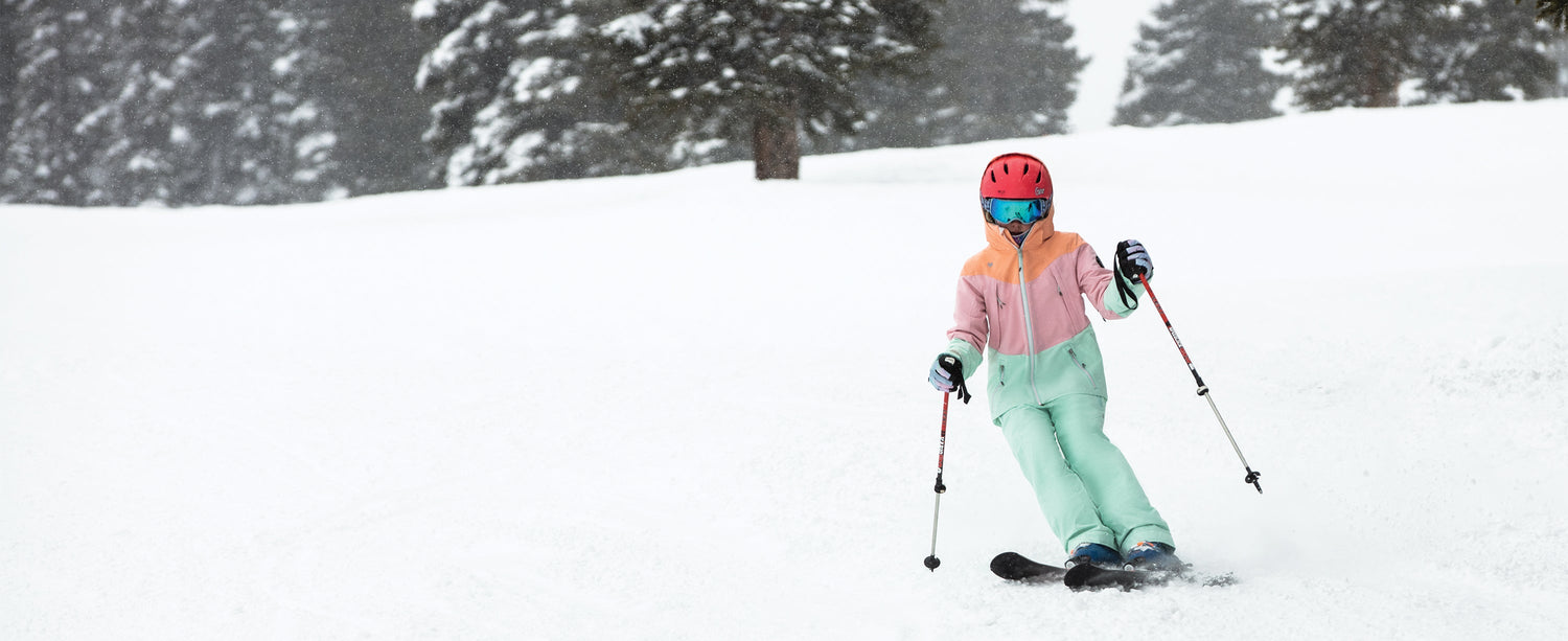 A teen girl skier wearing Obermeyer.