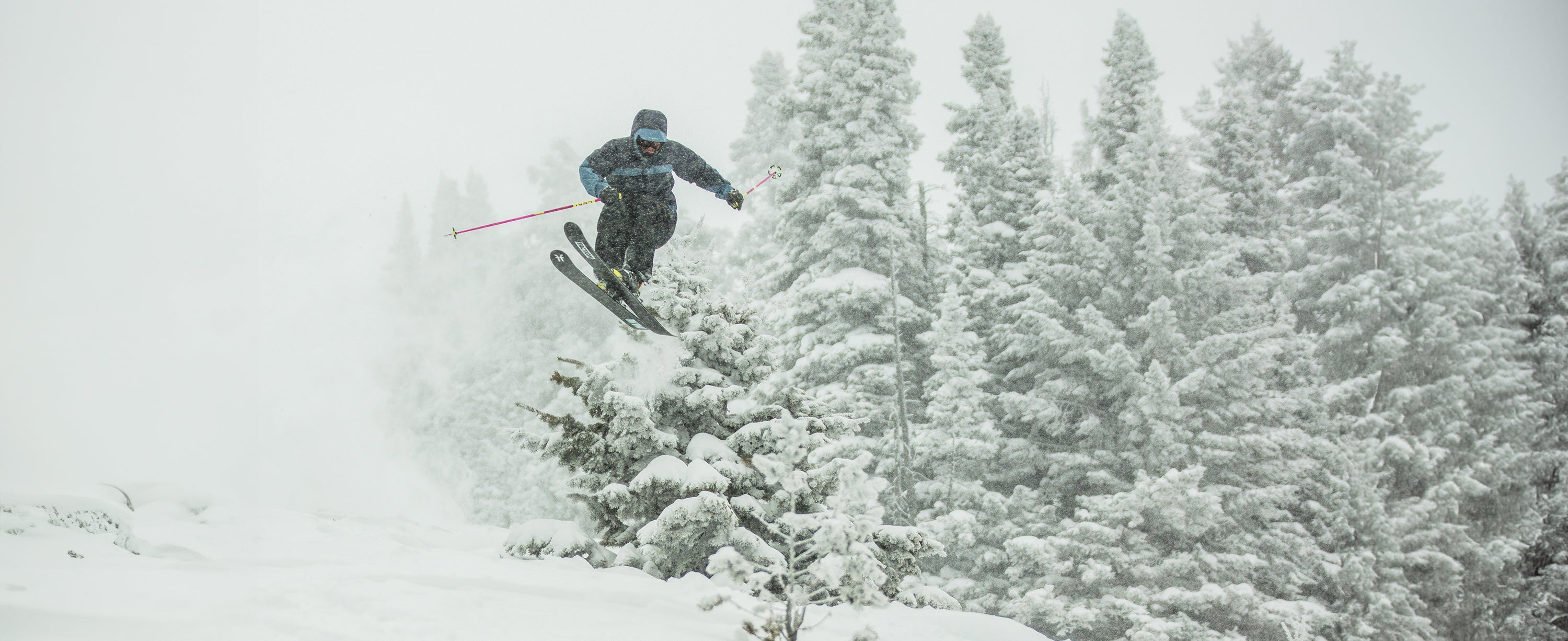 Male skier wearing Obermeyer shell pants.