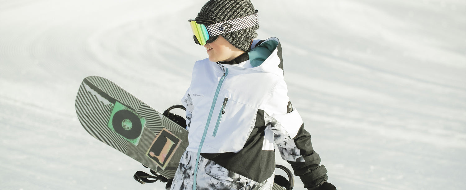 Teen boy snowboarder wearing an Obermeyer beanie.