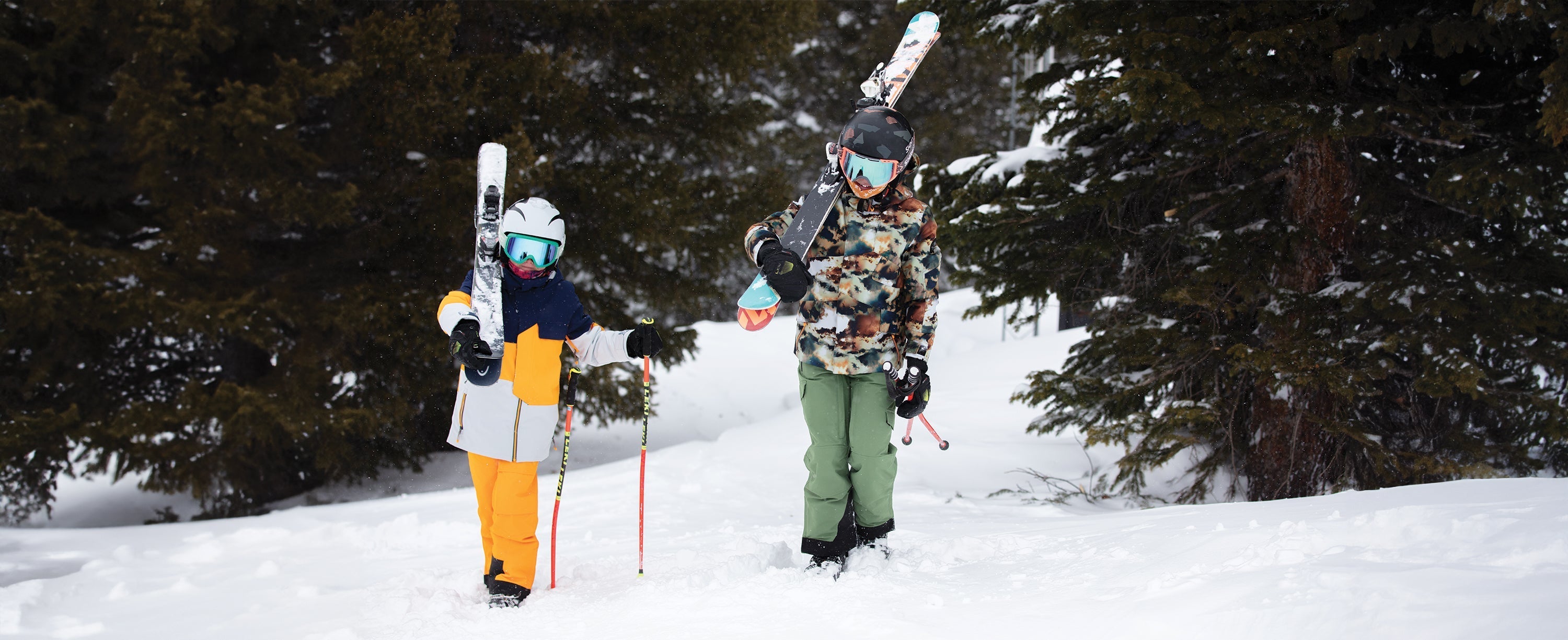 Two teen boys skiers wearing Obermeyer ski wear.