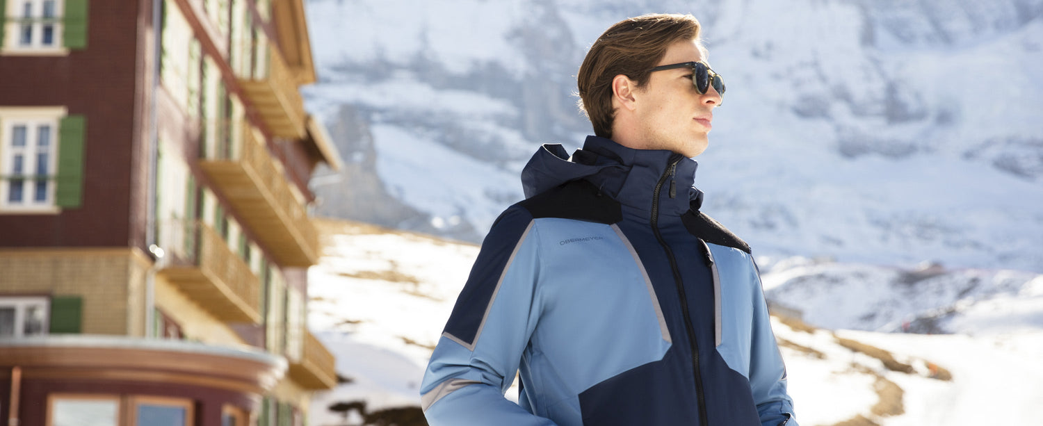 Male skiier wearing an Obermeyer jacket that features Primaloft insulation.