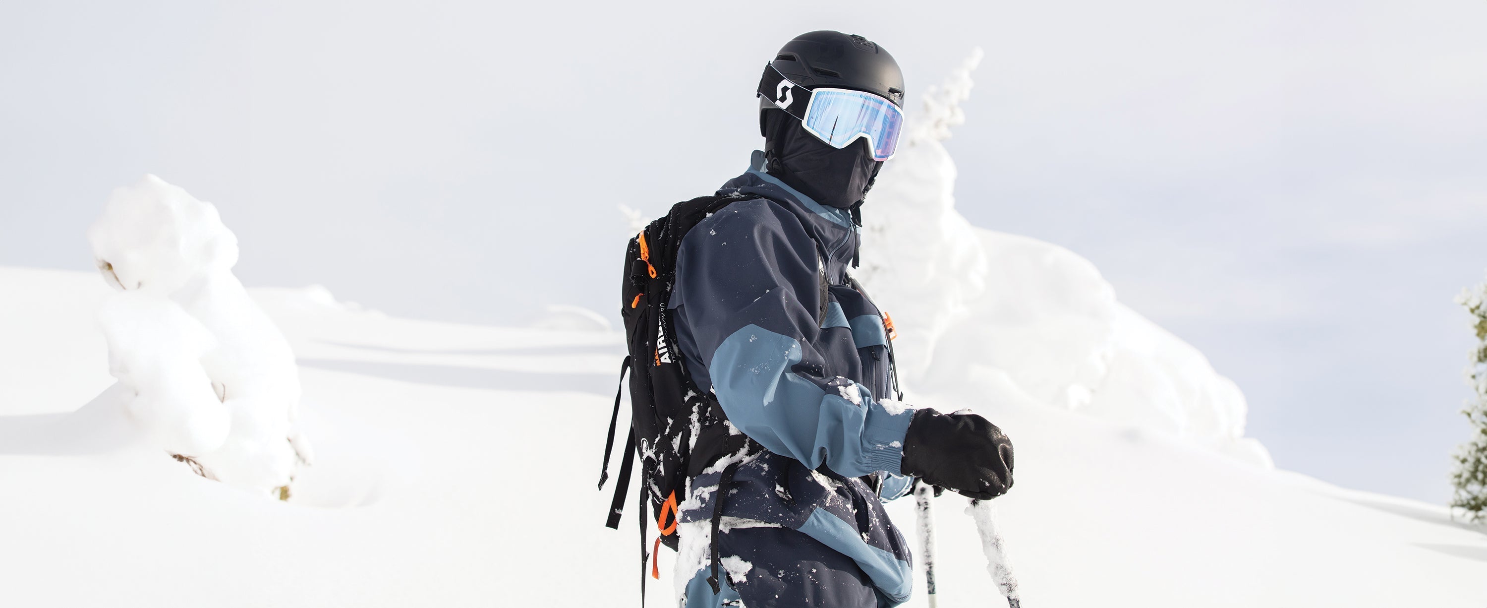 Male skier wearing Obermeyer ski apparel.
