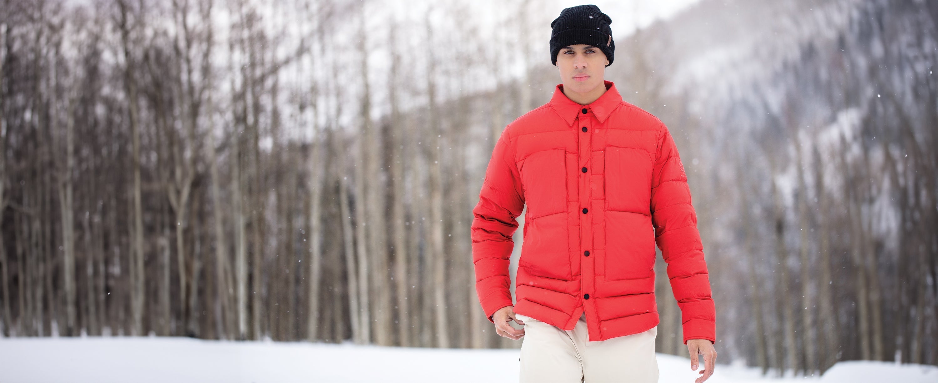 Male skier wearing an Obermeyer down jacket.