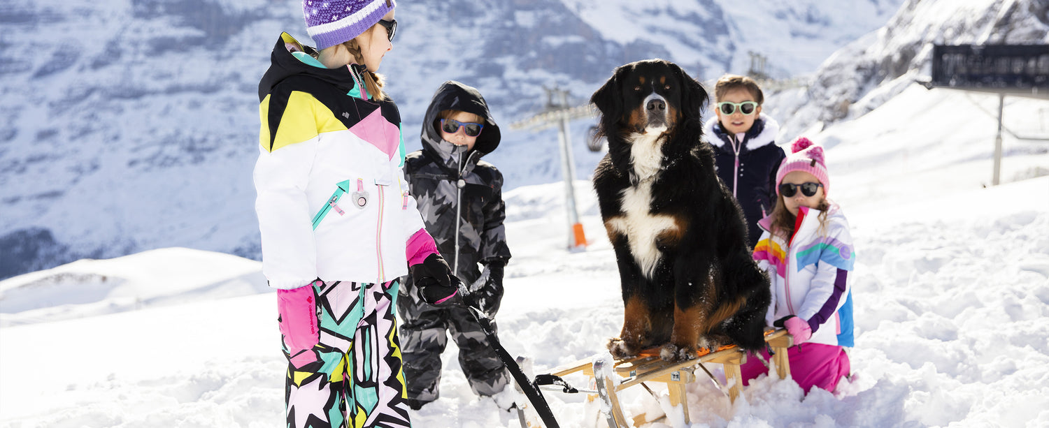 Group of kid skiers wearing Obermeyer ski apparel.
