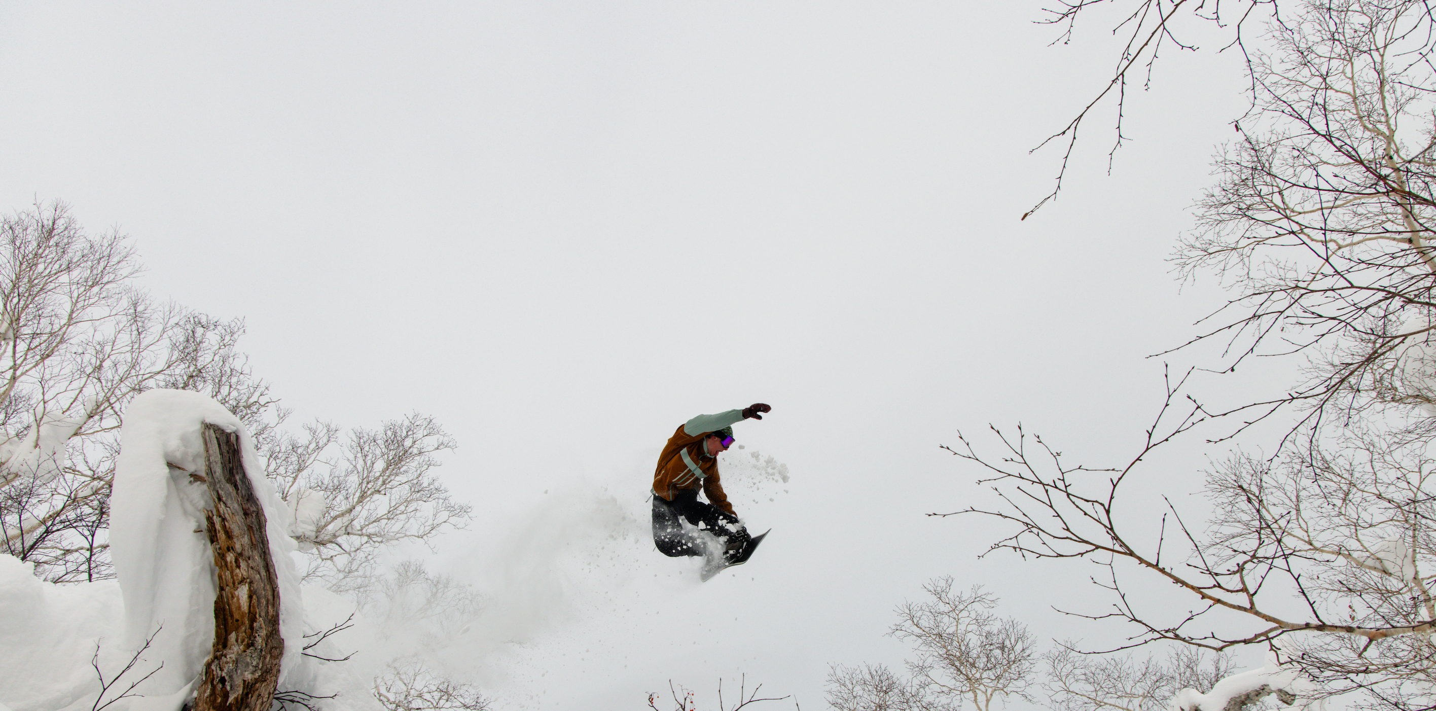 Male skier wearing Obermeyer shell pants.