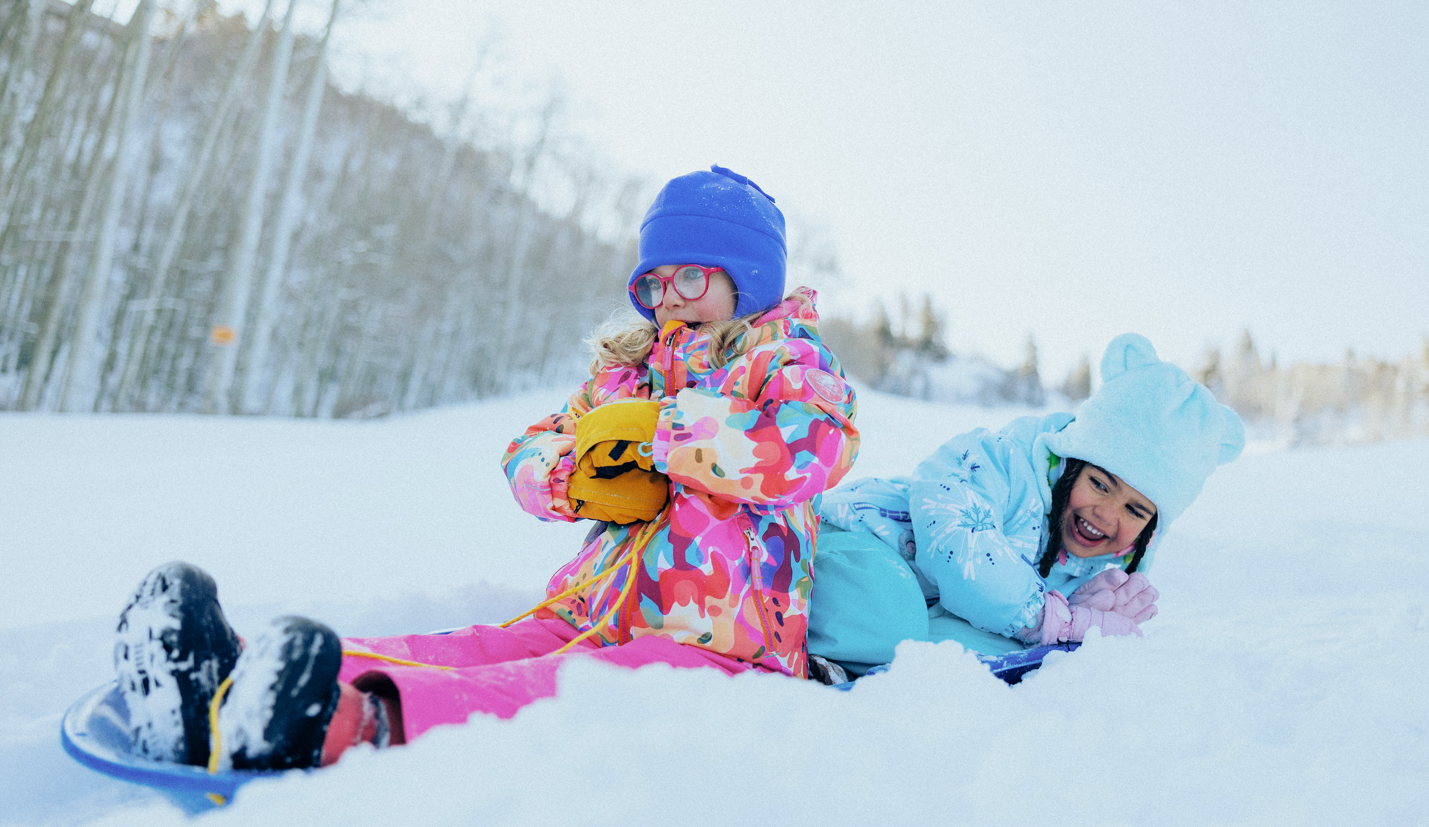 Kids wearing Obermeyer ski apparel featuring i-grow™
