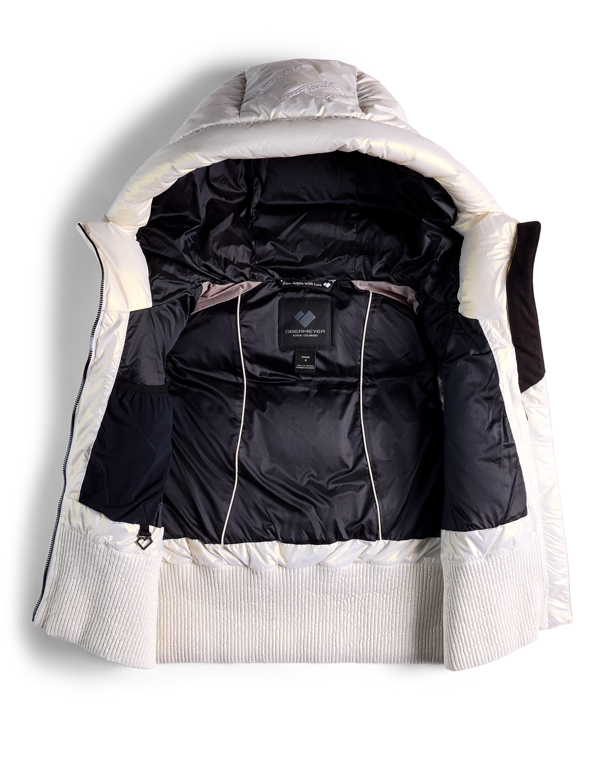 
A hooded puffer vest shown open from the front, featuring a black quilted interior and a white ribbed knit collar and cuffs, photographed on a clean white background.