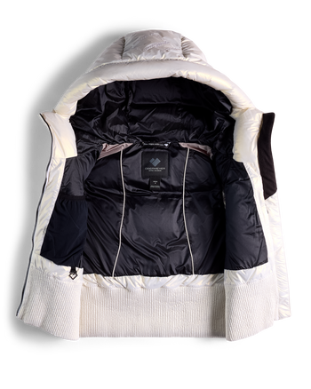 
A hooded puffer vest shown open from the front, featuring a black quilted interior and a white ribbed knit collar and cuffs, photographed on a clean white background.