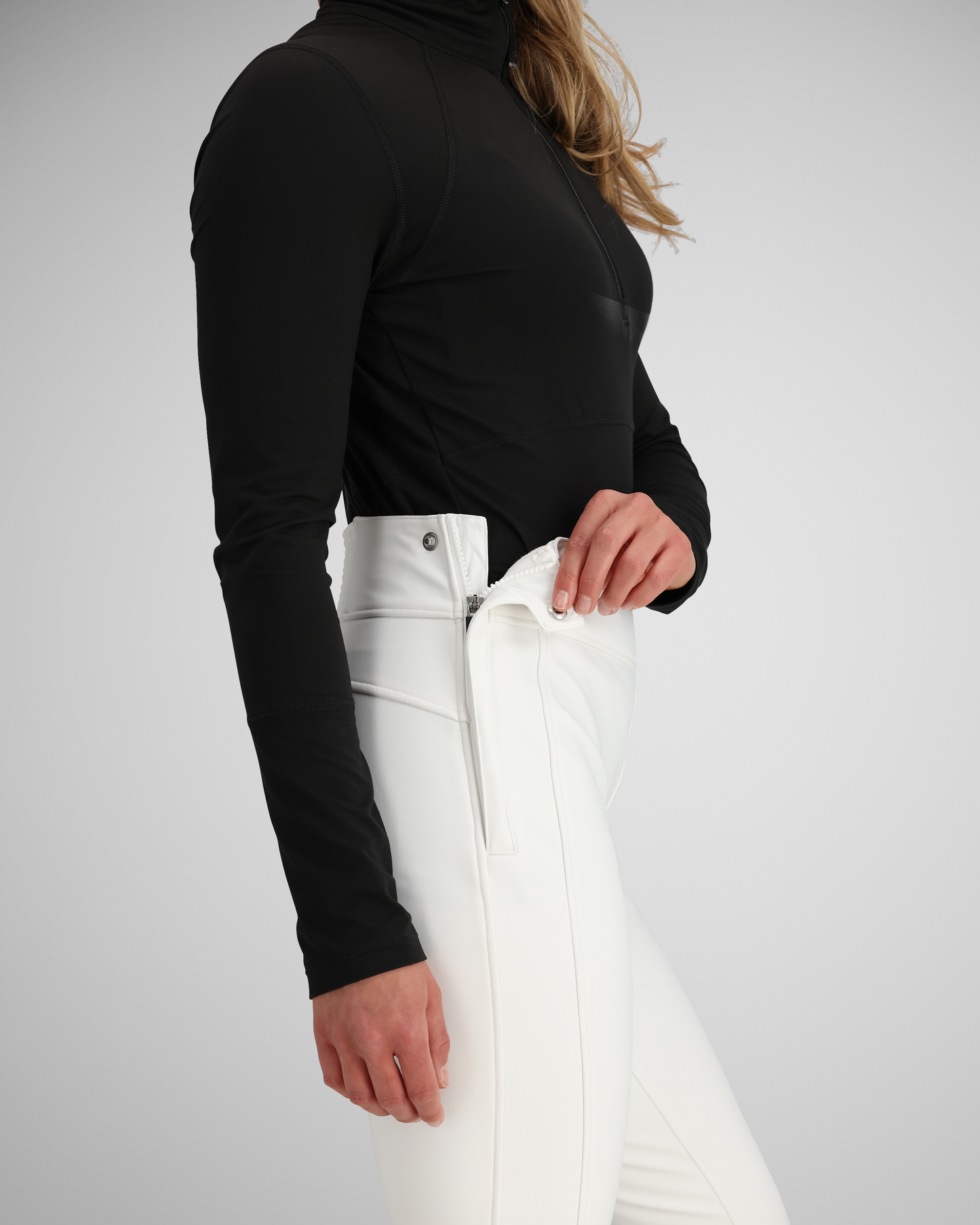 Side opening with snap closure | Getting in and out of these form-fitting pants is assisted with a side zipper opening with snap closure with best-in-class, secure snaps. 