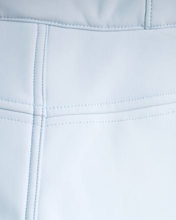 
Close-up of a light blue faux leather or vinyl material with stitched panel seams.