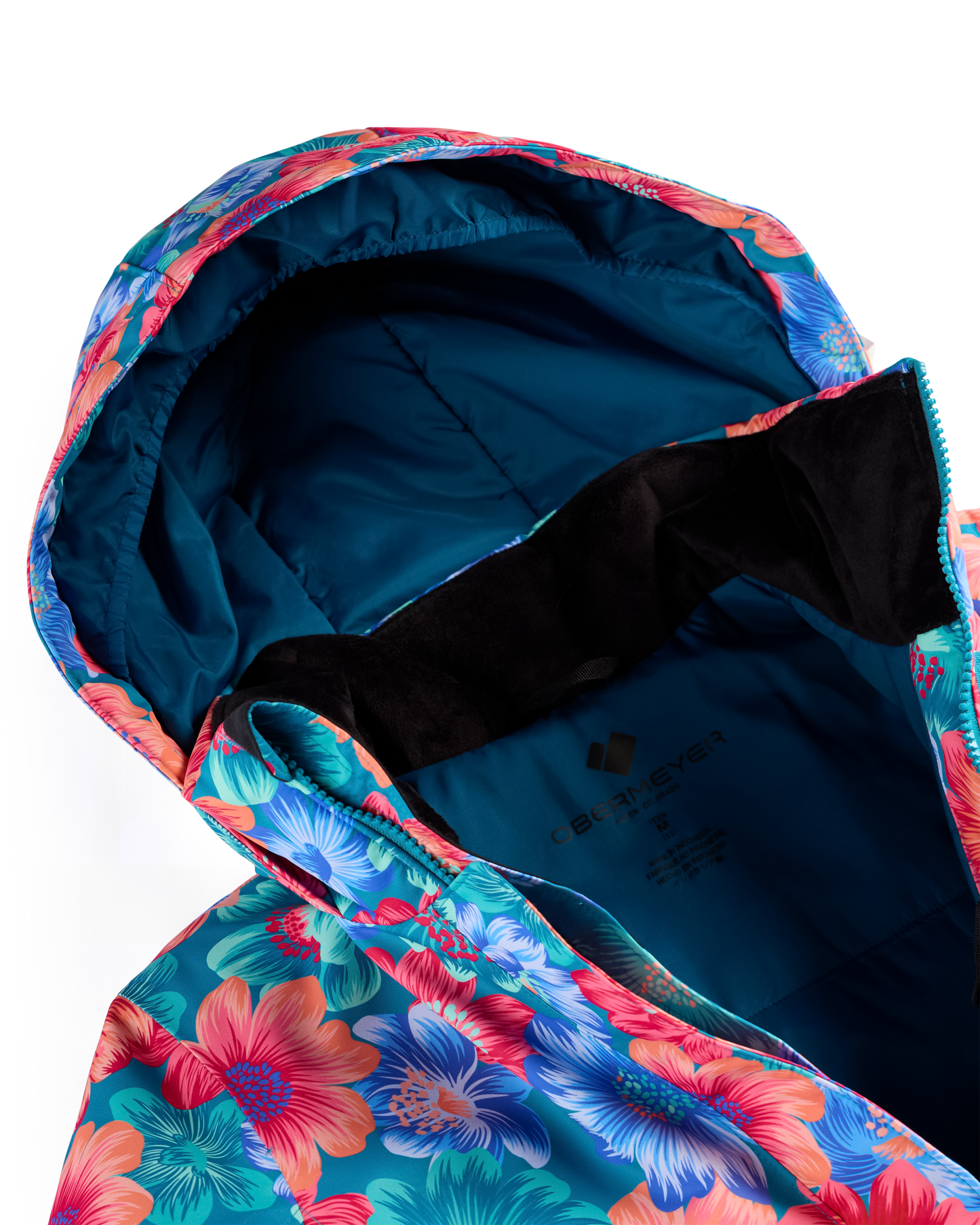 
Close-up of a hooded jacket with a bright floral print in pink, blue, and teal, shown open to reveal a dark blue interior lining and black fleece collar.