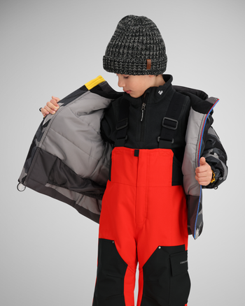 Water-resistant powderskirt | A section of elasticized fabric at the bottom of a jacket above the hem. It includes a gripper elastic bottom to create a snug barrier around your waist to keep snow and cold from going up your little one's back.