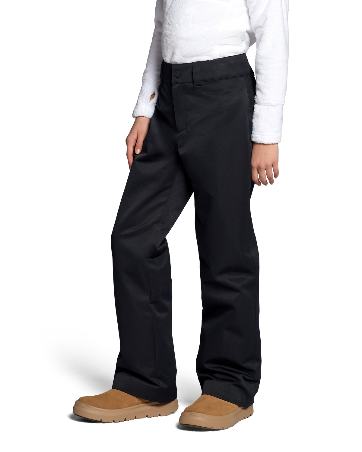 
A person wearing black wide-leg pants with a white long-sleeve shirt and tan slip-on shoes, shown from the waist down against a clean white studio background.